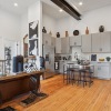 kitchen and living area with wood style flooring