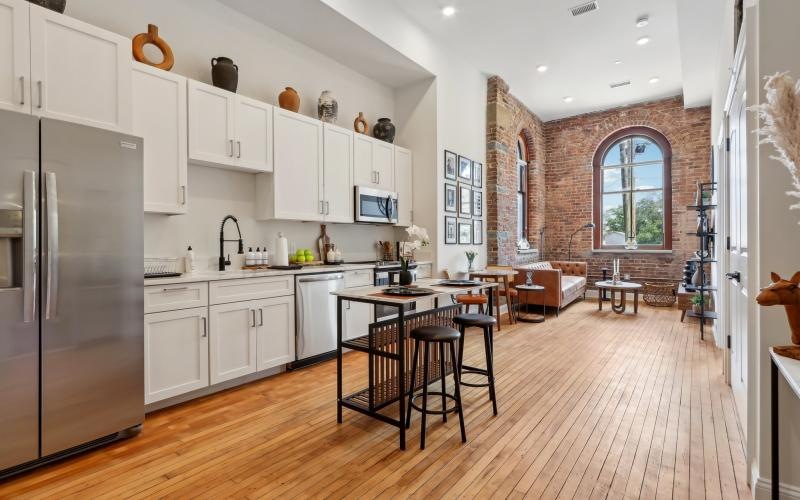 a kitchen with white cabinets