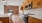 a kitchen with wooden cabinets