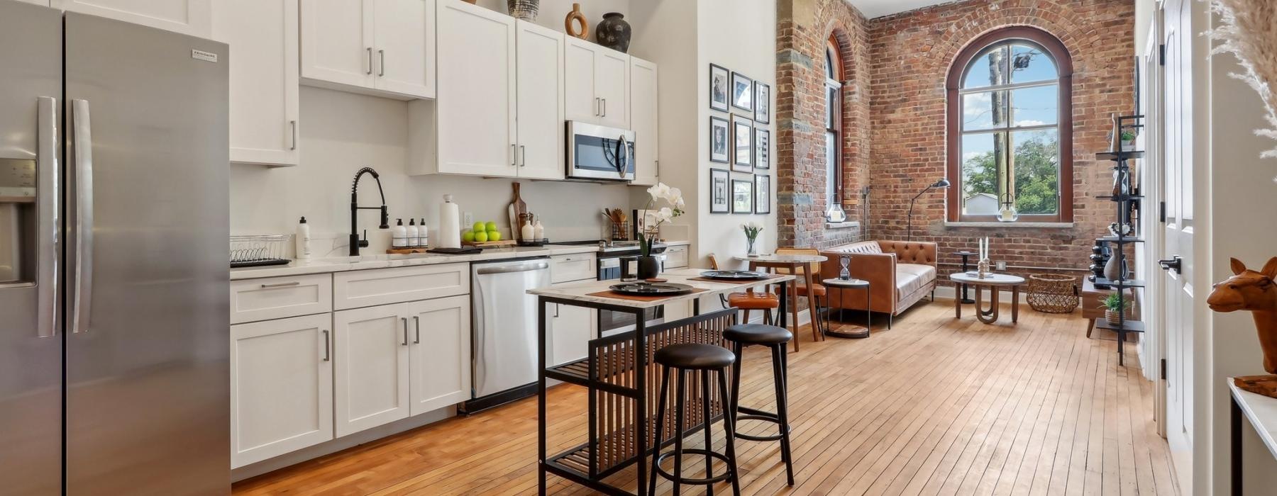 a kitchen with white cabinets