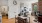 a living room with a table and chairs