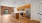 a kitchen with wooden cabinets