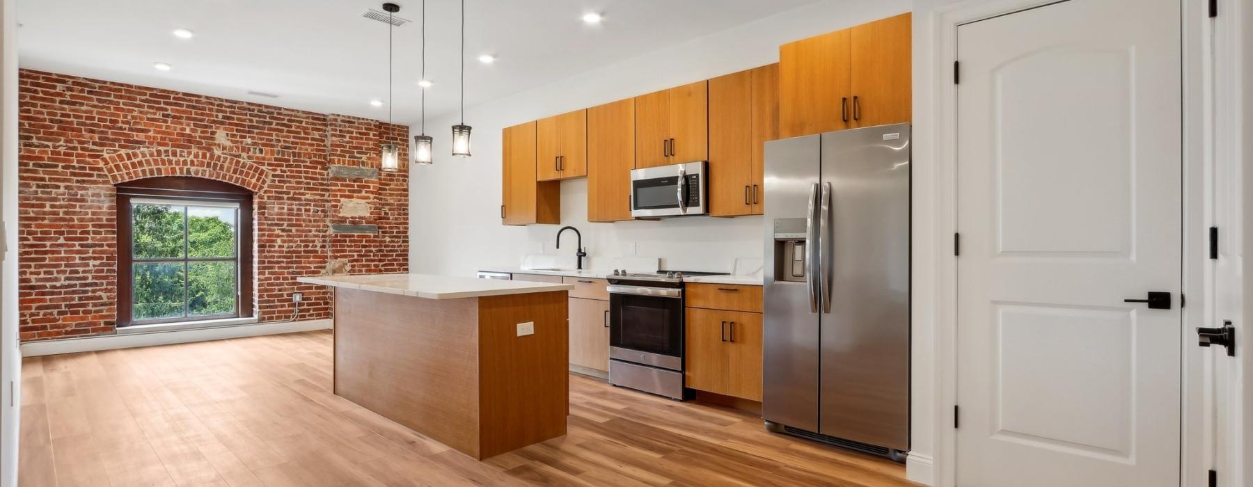 a kitchen with wooden cabinets