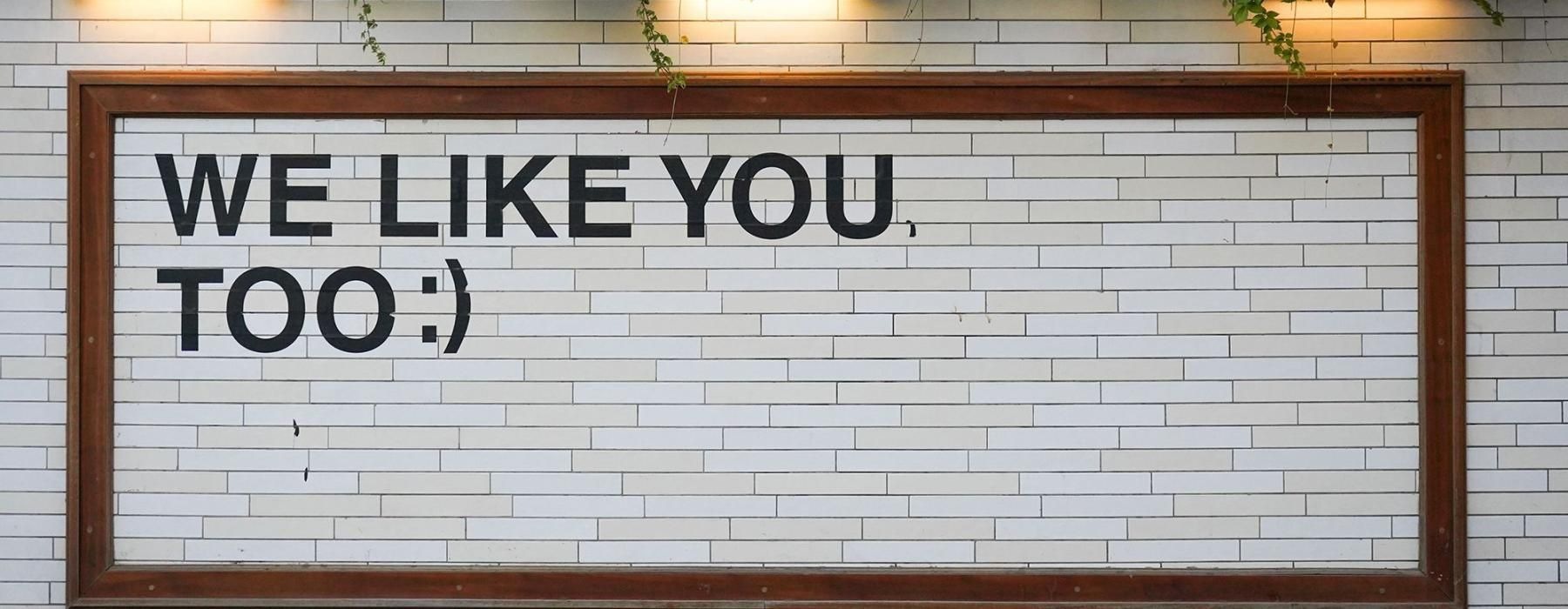 a sign on a tile wall